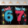 A vibrant graphic featuring the text I Was Six Now I Am Seven in blue and pink dripping paint against a black background.