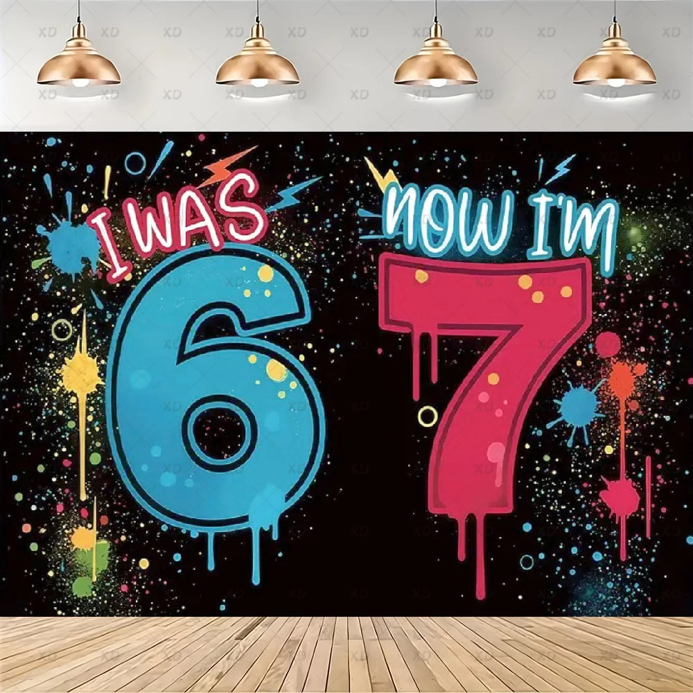 A vibrant graphic featuring the text I Was Six Now I Am Seven in blue and pink dripping paint against a black background.