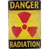 Vintage yellow and black sign with the word DANGER above a red radiation symbol and the word RADIATION below