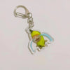 Acrylic keychain featuring a yellow banana cat design with light blue accents.
