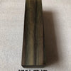A vertical rectangular block of dark, richly grained wood used as a blank for knife handles and DIY projects.