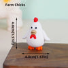 A white ceramic farm chick cake topper with a red beak and comb, shown next to a measurement guide.