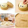 A yellow squishy toy shaped like a dumpling is shown in various packaging and usage contexts.