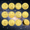 A collection of twelve gold-colored commemorative iron coins depicting zodiac symbols against a dark starry background.