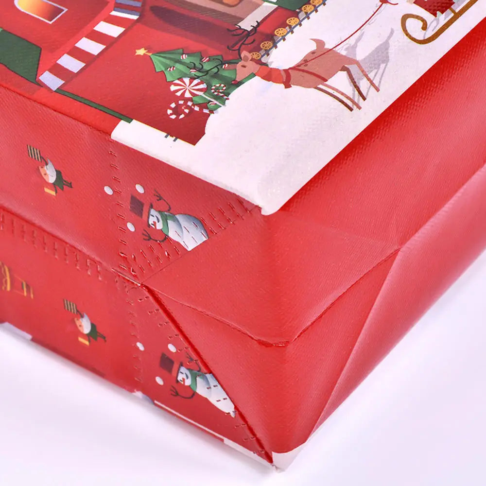 A red gift box featuring holiday prints of reindeer and Christmas elements.