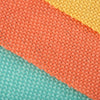 A close-up of a colorful jute linen pennant banner set featuring orange, yellow, and teal fabric strips.