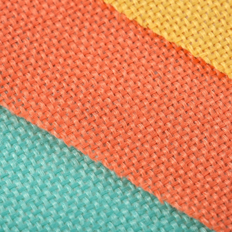 A close-up of a colorful jute linen pennant banner set featuring orange, yellow, and teal fabric strips.