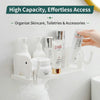 White adhesive elephant storage rack organizing skincare, toiletries, and accessories on a wall shelf