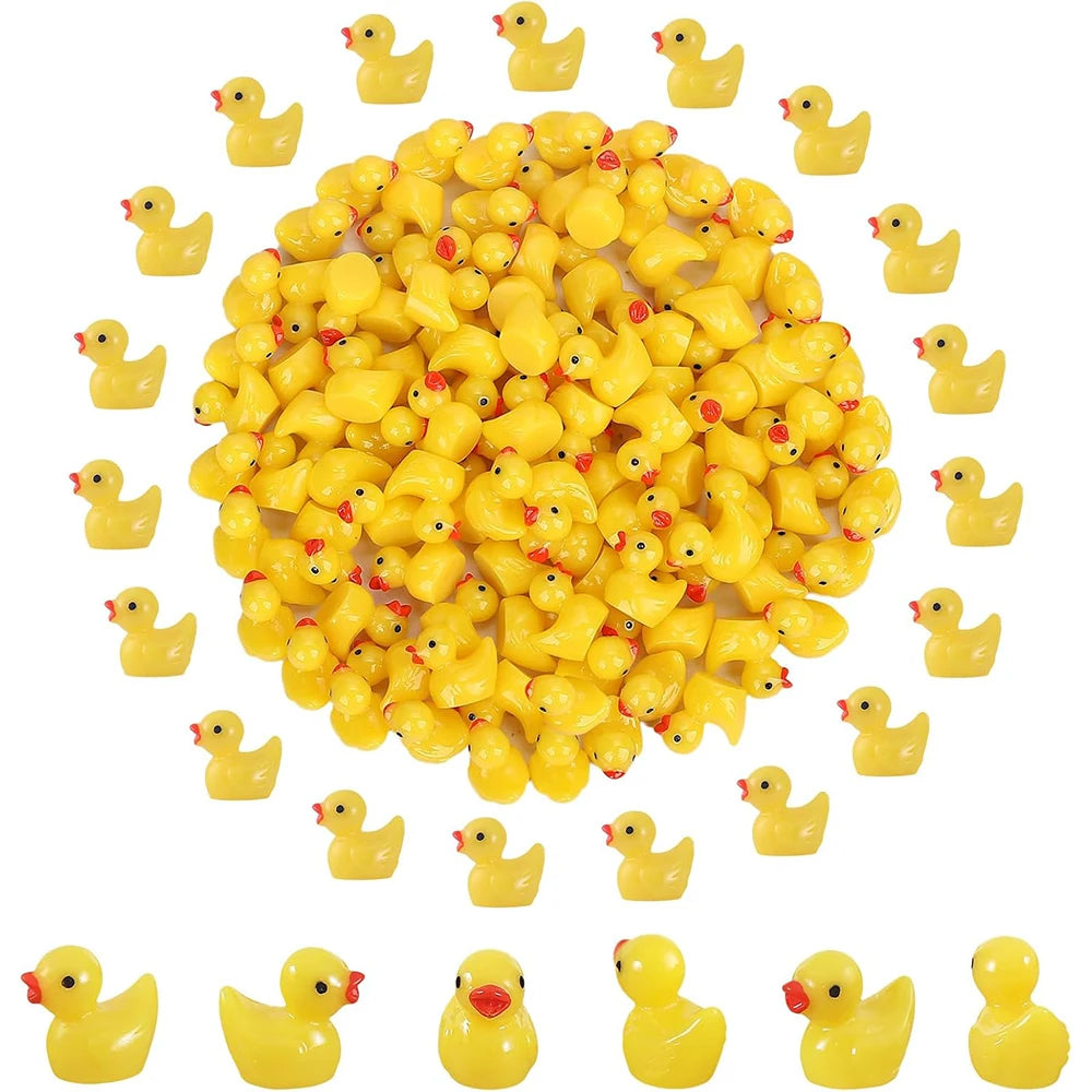 A collection of small yellow resin duck figurines arranged in a circular pattern.