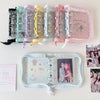 A display of clear and colored glitter star card binders for collectibles.
