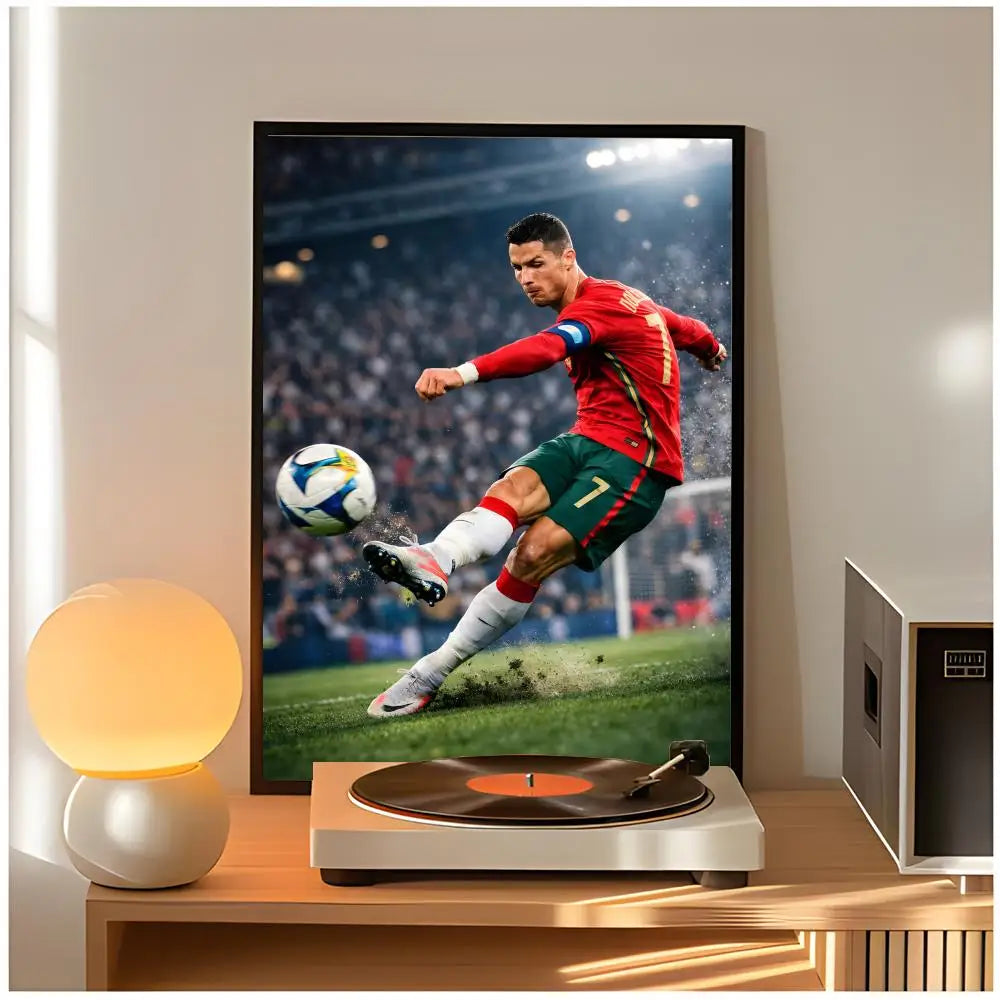 A poster of Cristiano Ronaldo in a red jersey playing soccer, displayed on a wooden table.