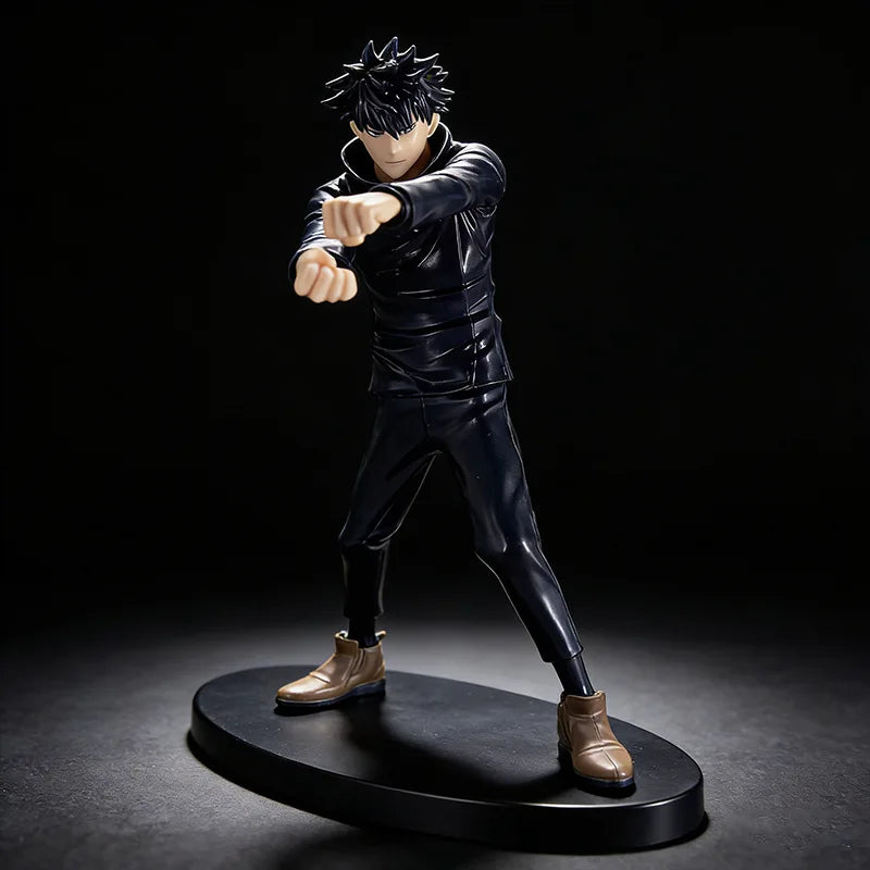 A dark figurine of an anime character with spiky black hair in a fighting pose.