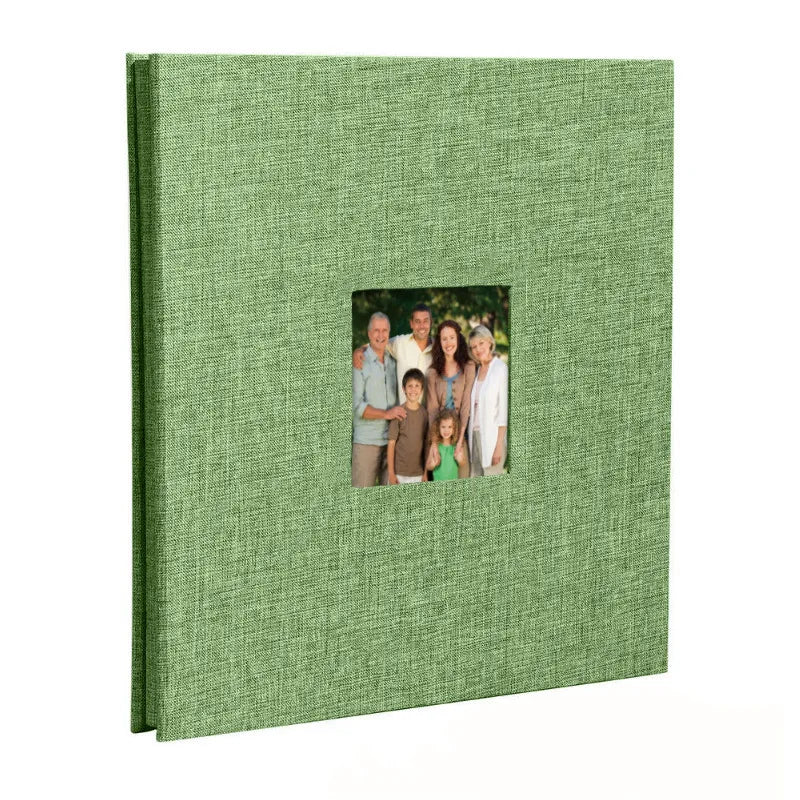 A green linen front scrapbook memory book with a photo of a family.
