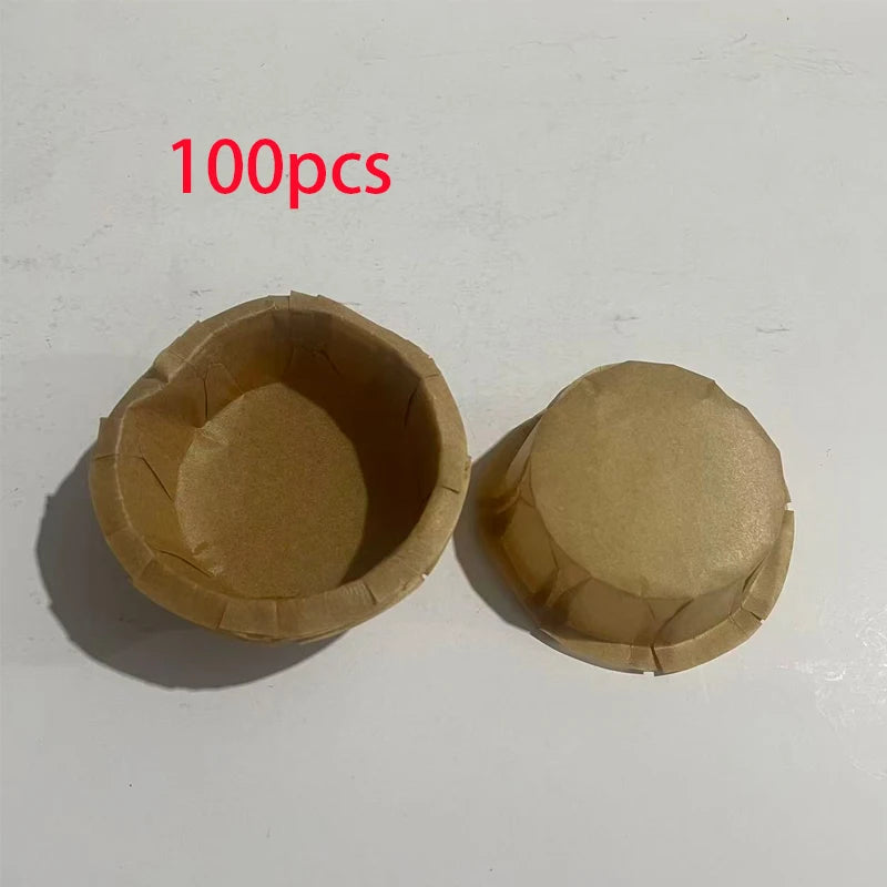 A set of 100 fluted paper cups for baking and party decor, shown in light brown color.