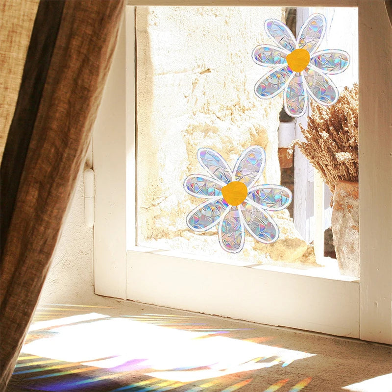 A daisy flower sun catcher decal is visible on a window, casting colorful light patterns on the floor.