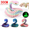 Three variations of a 3D printed articulated snake fidget toy in various pastel and vibrant colors.