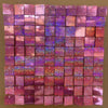 A grid of iridescent pink and purple sequin shimmer wall panels used as a sparkling backdrop.