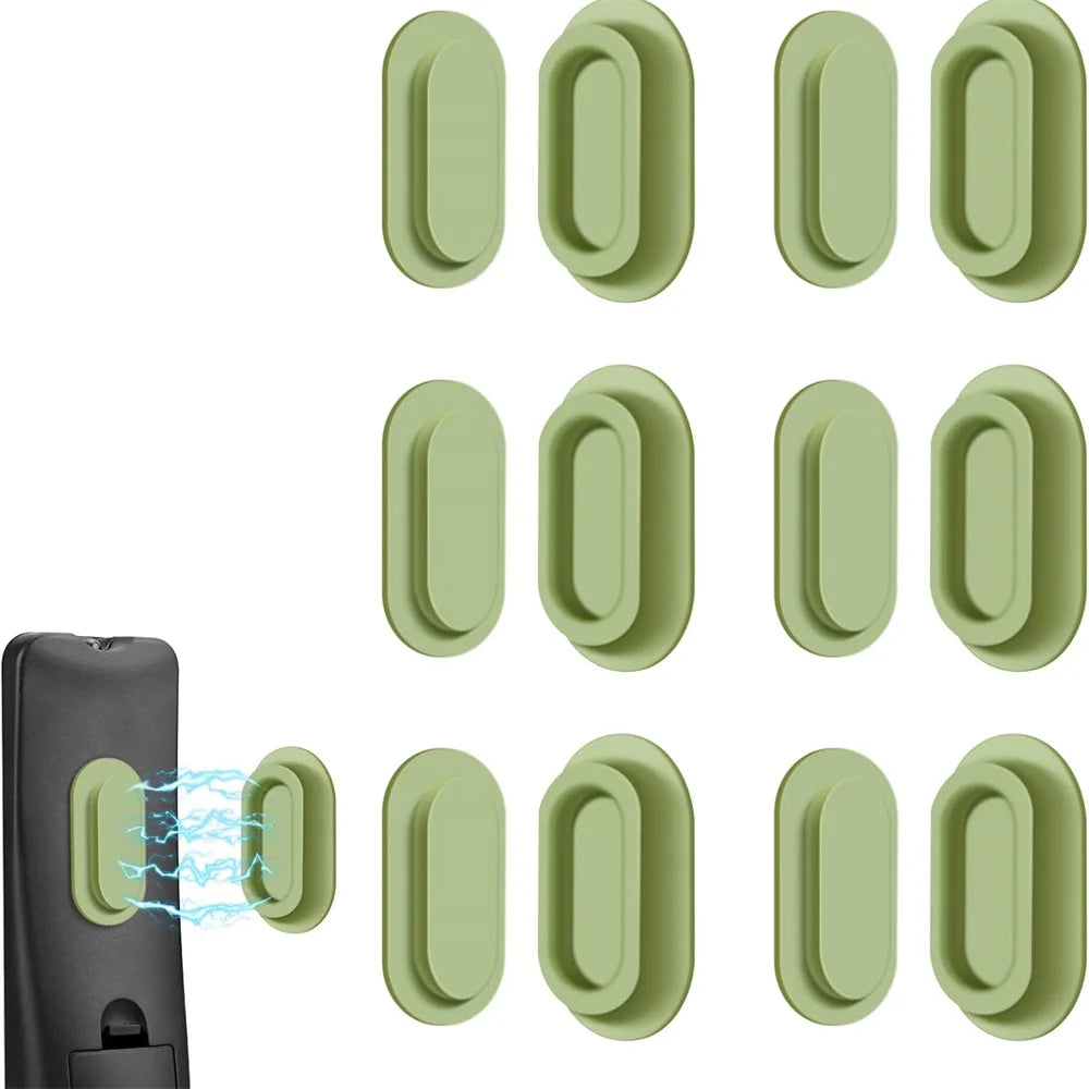 A set of magnetic silicone remote control holders in a light green color shown next to a black device.