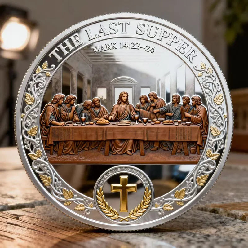 A silver commemorative coin featuring a scene of the Last Supper with Jesus and disciples, surrounded by laurel leaves and a 
