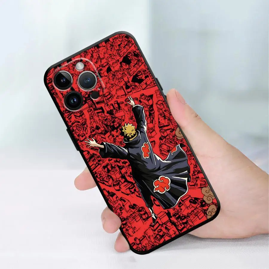 A red and black patterned Akatsuki anime soft TPU phone case is held in a hand.