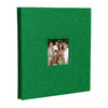 A green linen front scrapbook memory book with a photo of a family.