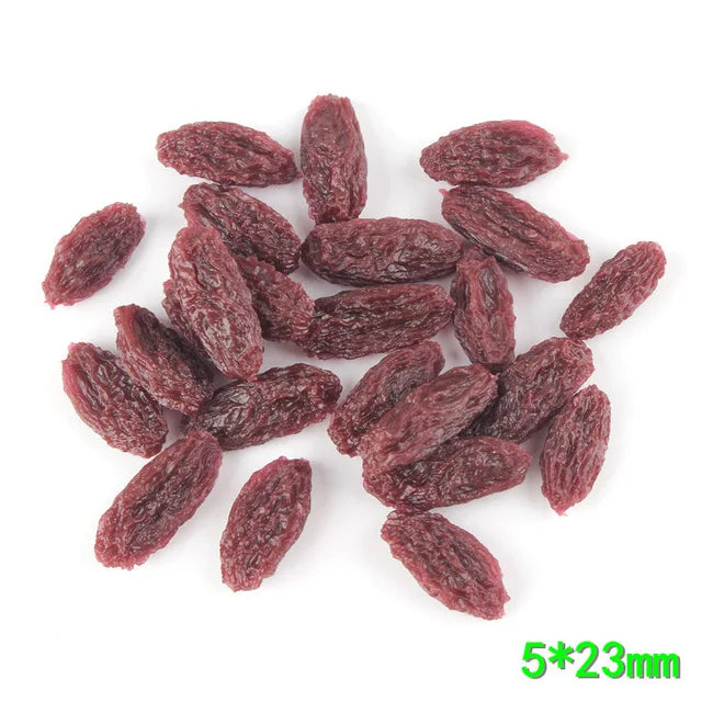 A pile of dark red, dried corn kernels or miniatures for crafting and décor.