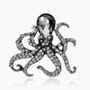 Silver vintage marine life brooch pin set featuring a large diamond-cut spider and a gemstone