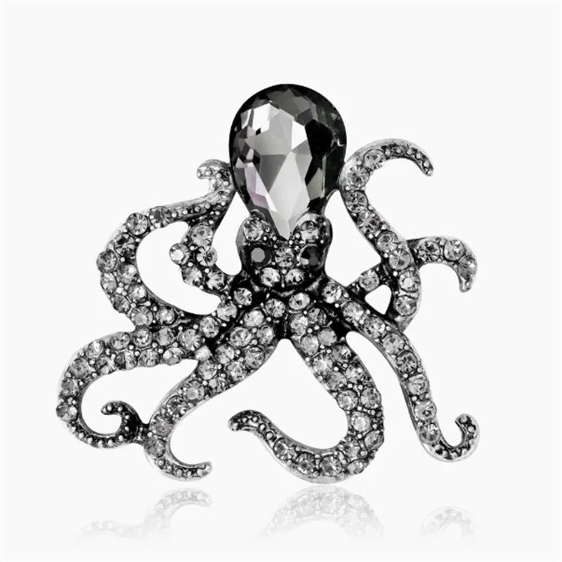 Silver vintage marine life brooch pin set featuring a large diamond-cut spider and a gemstone