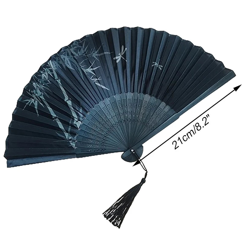 A dark blue elegant vintage Chinese folding hand fan shown with its full spread and folded tip.
