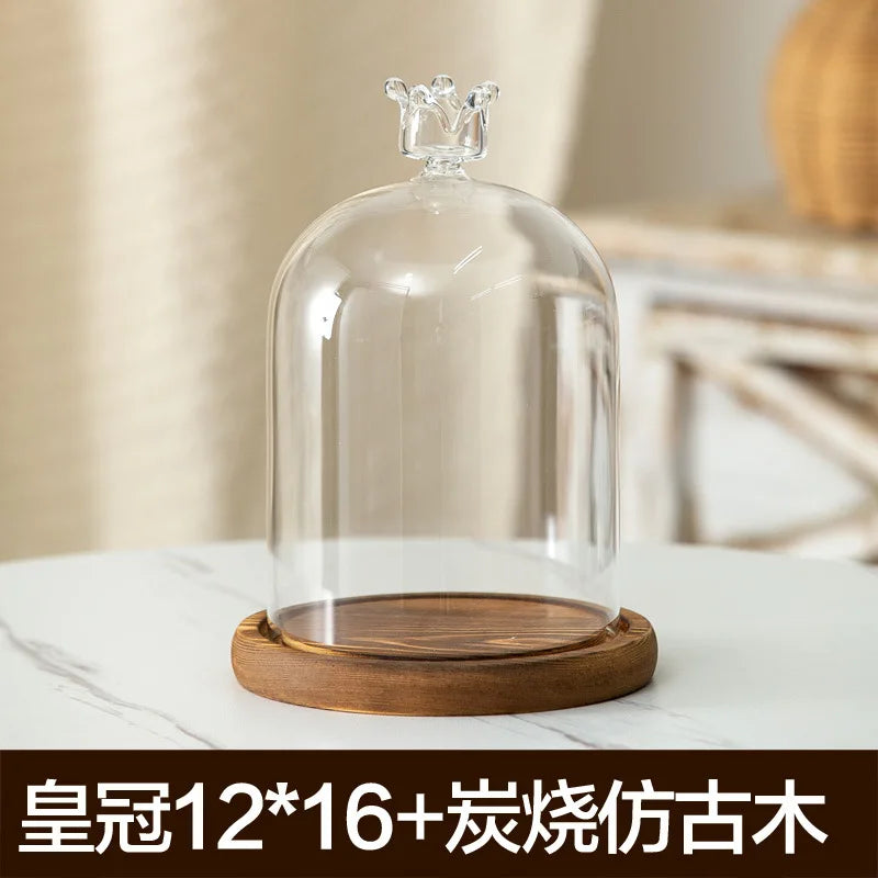 Clear glass aromatherapy candle holder with a wooden base and dust-proof cover