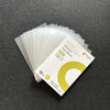 A stack of clear protective card sleeves is shown on a dark surface.