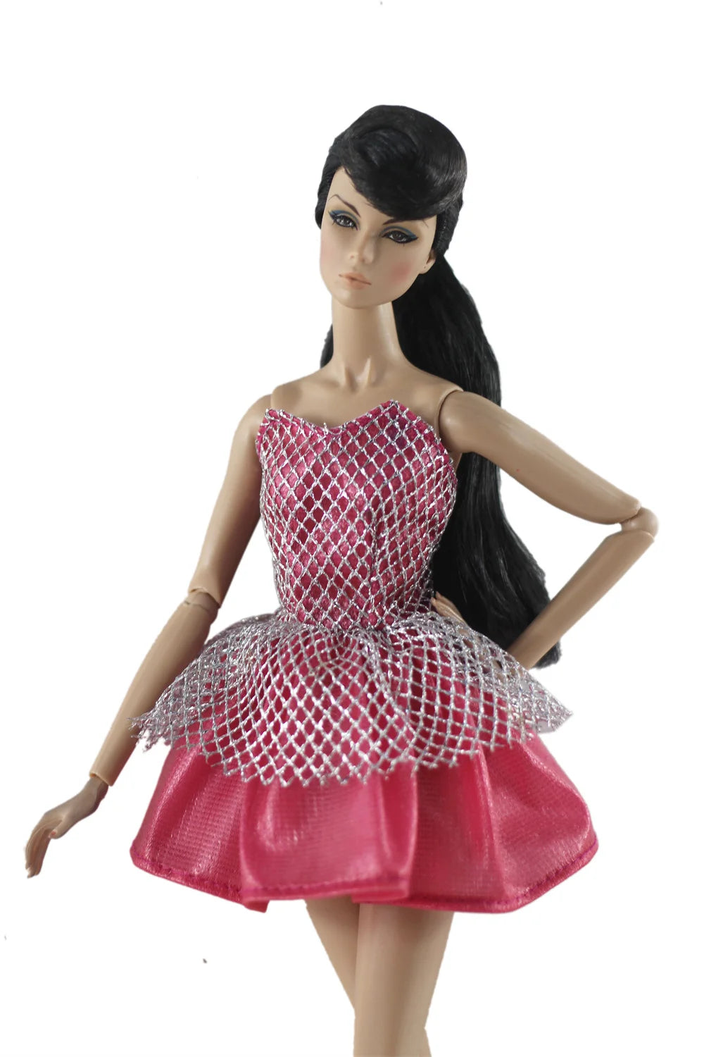A female doll wearing a pink and silver mesh dress gown.