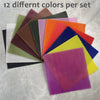 A collection of twelve different colored honeycomb beeswax candle DIY kits arranged in a fan shape.