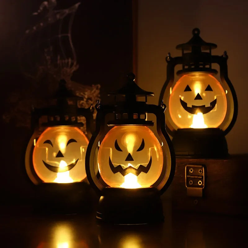 A set of three DIY Halloween pumpkin lanterns with glowing LED faces casting eerie light.