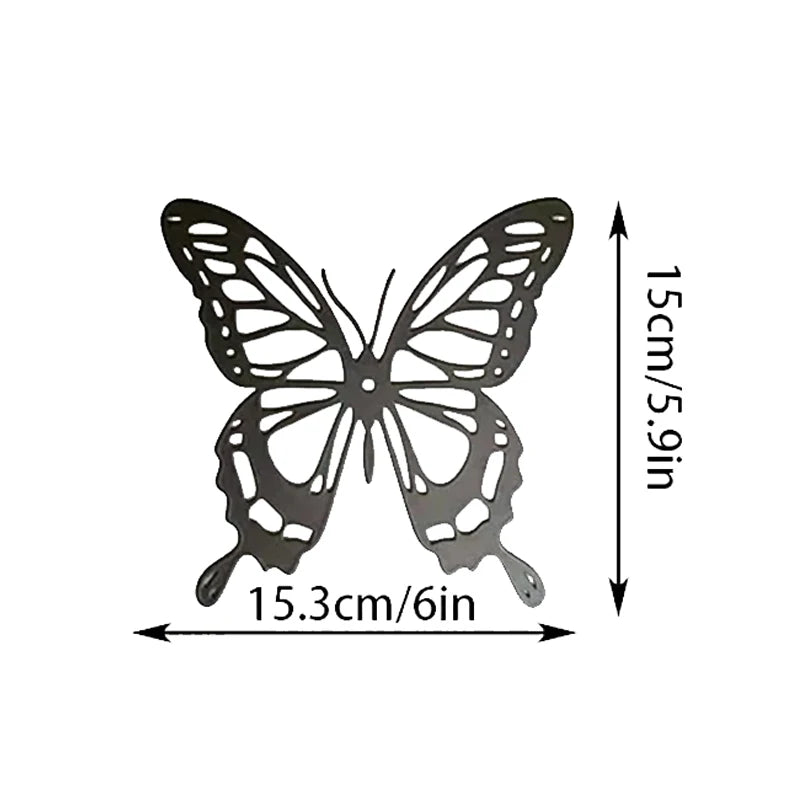 Black metal butterfly wall art set featuring two symmetrical butterfly shapes with dimensions of 15.3cm by 15cm.