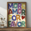 Framed canvas wall art featuring the text MORE AMOR FOR FAVOR in various pastel colors.