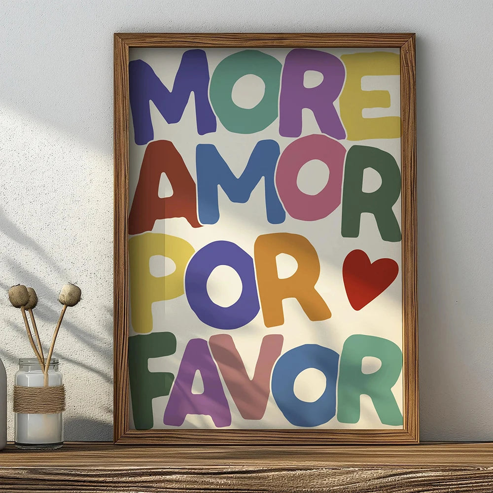 Framed canvas wall art featuring the text MORE AMOR FOR FAVOR in various pastel colors.
