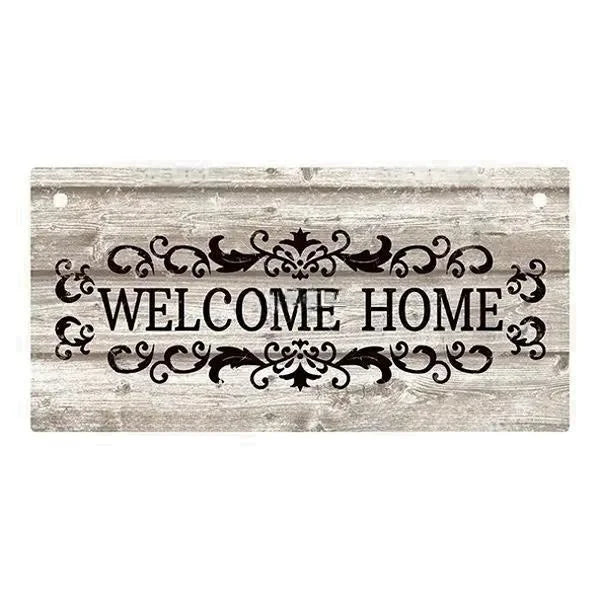 Rustic wooden hanging sign with the words Welcome Home carved into the wood.