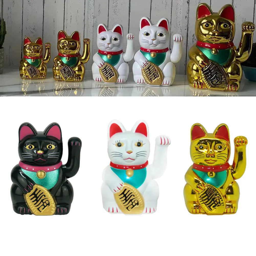 A collection of electric waving lucky cat figurines in gold and white, depicting cats for good fortune.