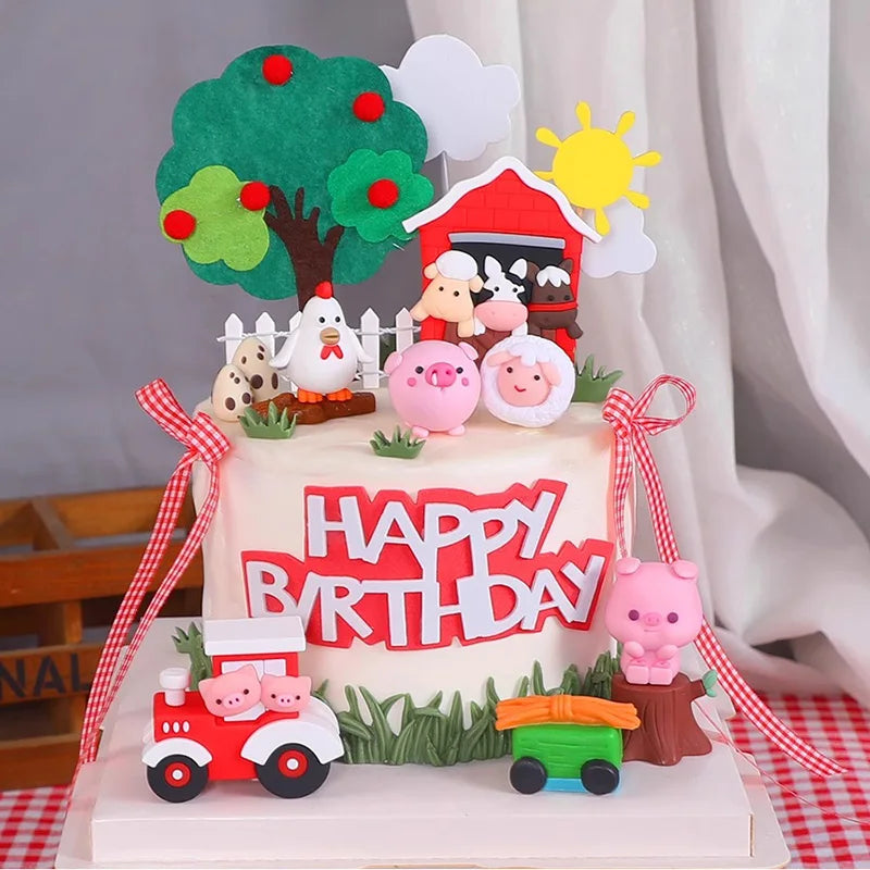 A tiered birthday cake decorated with farm animal toppers including a tree, sun, pig, and tractor.