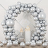 A large balloon garland arch made of metallic silver balloons with confetti accents.