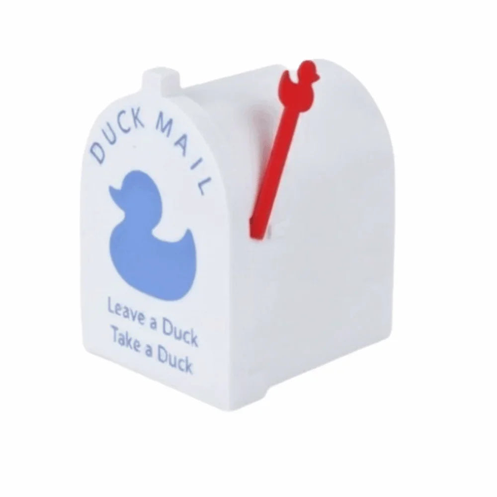 White magnetic duck mailbox cover with a red key inserted and text reading Leave a Duck Take a Duck