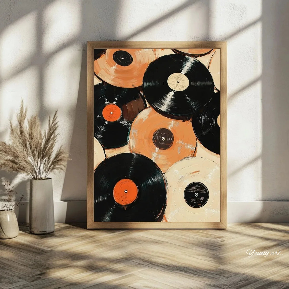 A framed canvas art print featuring a collection of black and orange vinyl records against a light background.