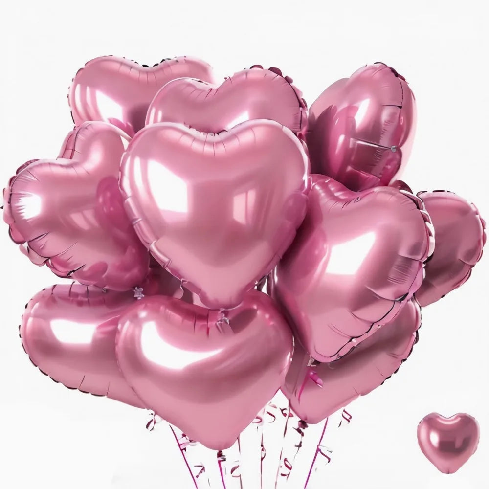 Ein Set rosa Herzballons aus Folie, mit sichtbaren Schnüren darunter.