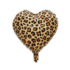 A heart-shaped balloon covered in a leopard print pattern for birthday parties