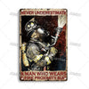A vintage metal sign featuring a distressed firefighter helmet and gear, with the text NEVER UNDERESTIMATE A MAN WHO WEARS A 
