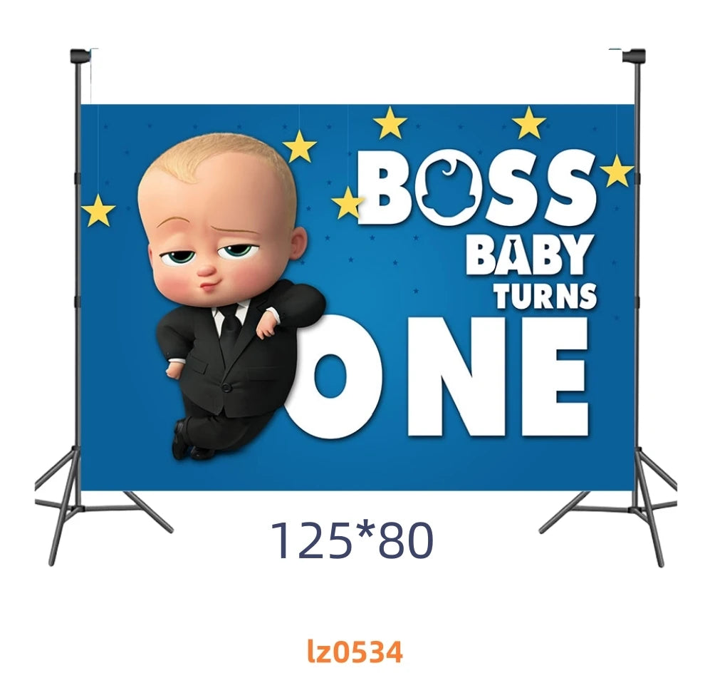 A cartoon baby character wearing a suit is featured on a blue banner with text that reads Boss Baby Turns One