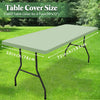A rectangular table cover for a 6-foot table shown lying flat on green grass.