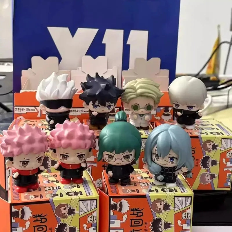 A collection of Jujutsu Kaisen blind box collectible figures in various poses and colors displayed in their packaging.