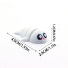 A white 3D printed cartoon animal figurine with large eyes and stacked rings, shown with dimensions.